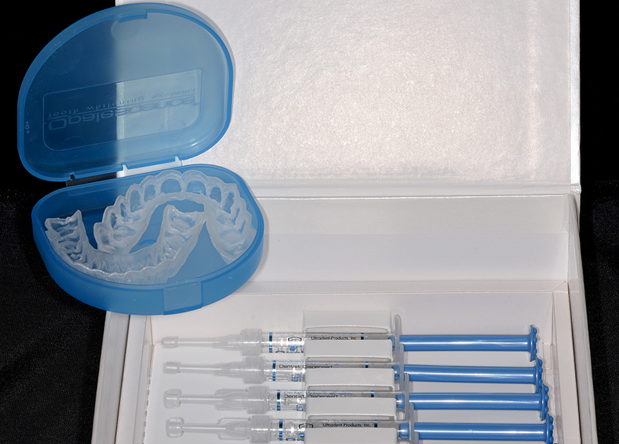 Trays and whitening gel syringes for home application